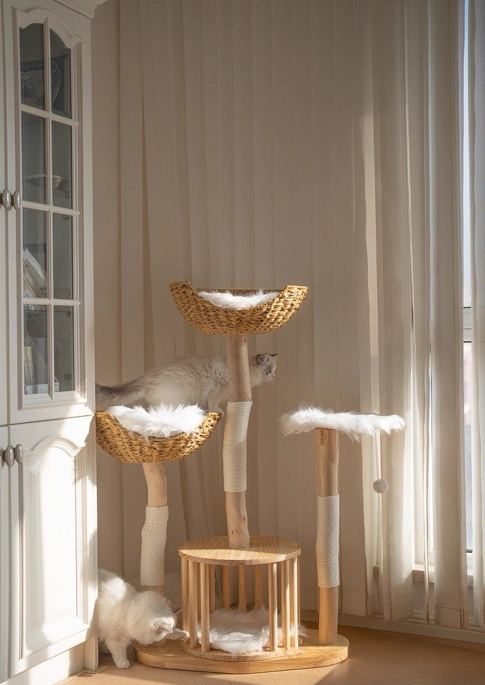 Luxury multi-tier rattan cat tree with natural wood posts and woven baskets in elegant home setting