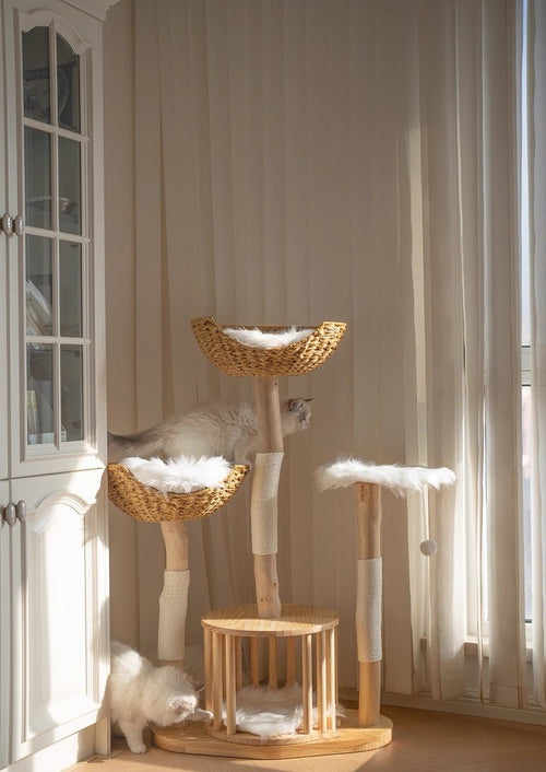 Luxury multi-tier rattan cat tree with natural wood posts and woven baskets in elegant home setting