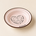 Pink MeAura cat feeding bowl with a dark rim and heart-shaped cat illustration
