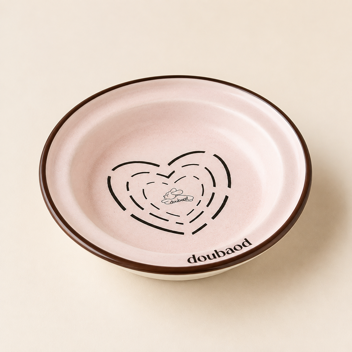 Pink MeAura cat feeding bowl with a dark rim and heart-shaped cat illustration