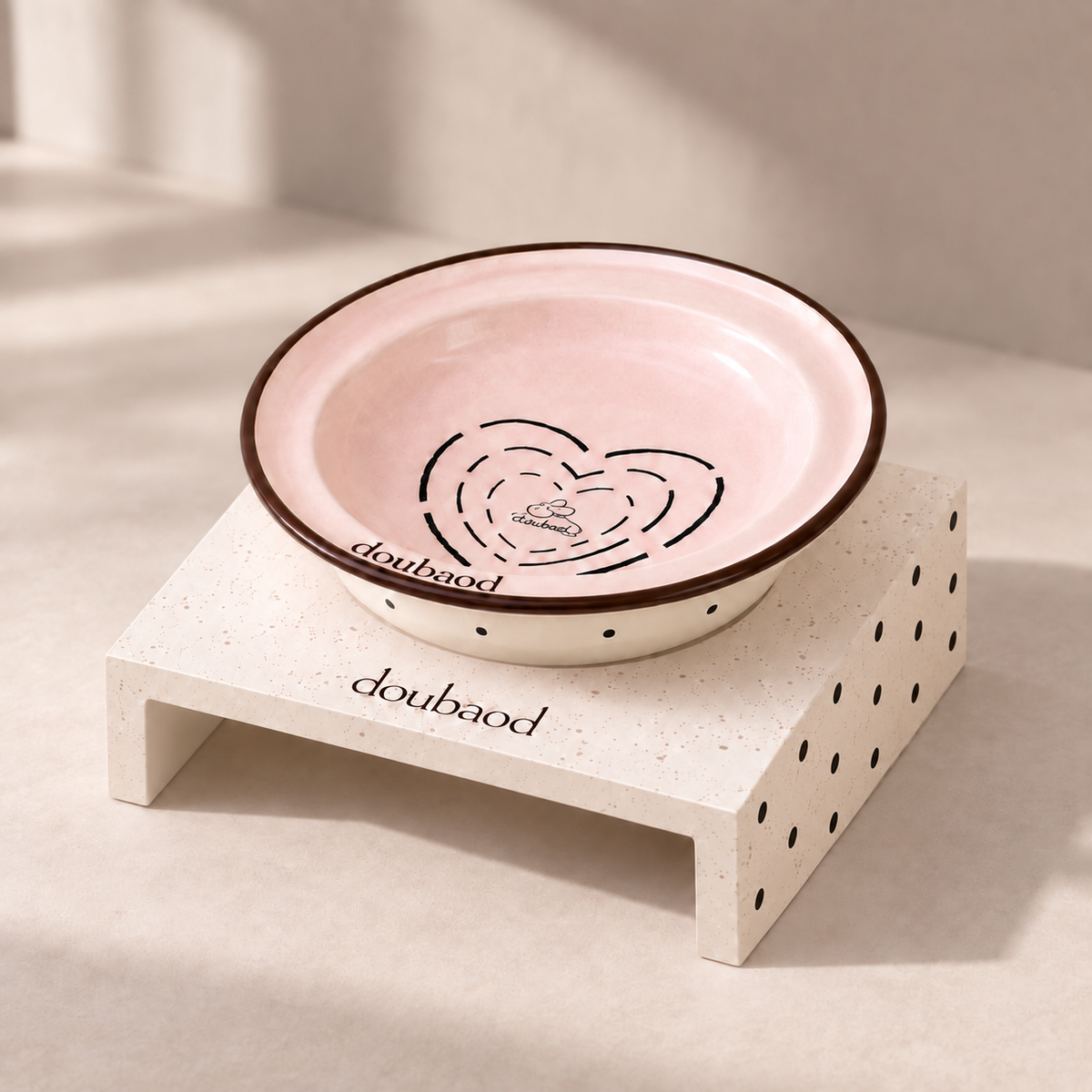 Pink MeAura cat feeding bowl on a cream stand with a dotted side panel
